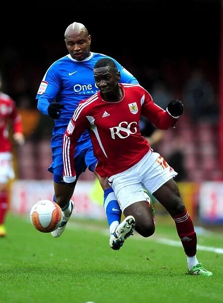 Championship Showdown: Bolasie vs. Diouf - The Intense Rivalry Between Yannick Bolasie of Bristol City and El-Hadji Diouf of Doncaster Rovers (2012)