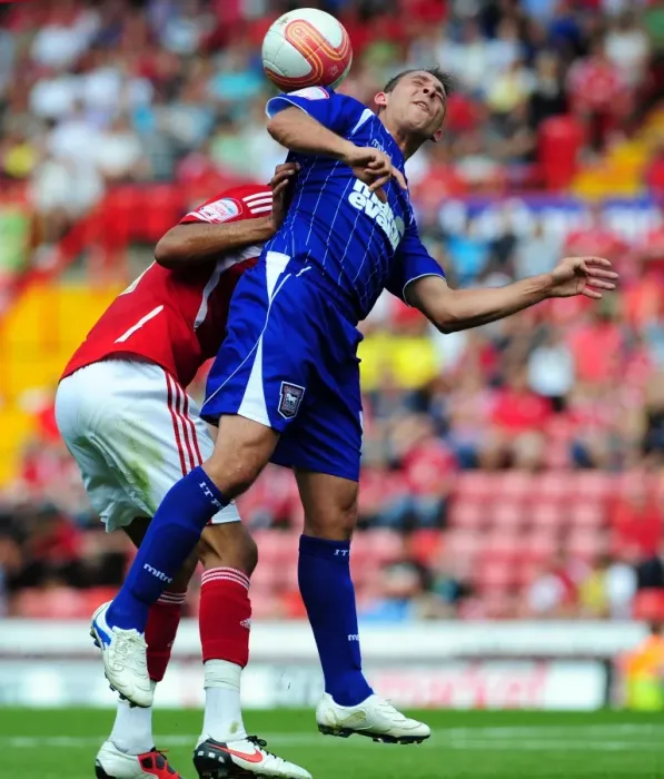 Framed Print : Championship Showdown: Chopra vs. Fontaine - A Battle for Aerial Supremacy at Ashton Gate (Bristol City v Ipswich Town, 06 / 08 / 2011)