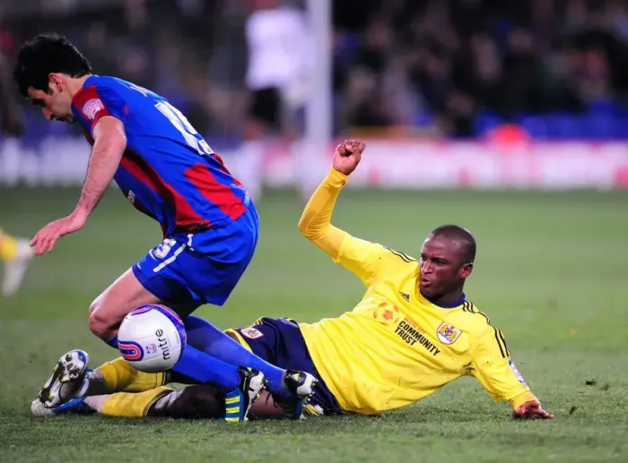 Framed Print : Championship Showdown: Cisse vs Jedinak - Tackle Battle at Selhurst Park (15 / 10 / 2011)