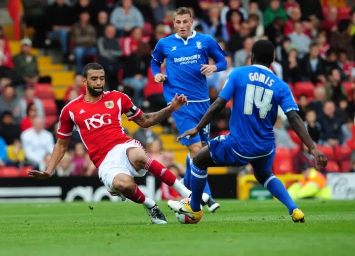 Framed Print : Championship Showdown: Fontaine vs. Gomis - Liam Fontaine Tackles Morgaro Gomis (October 23, 2011): A Pivotal Moment in Bristol City vs. Birmingham City Football Match