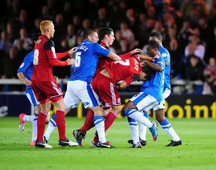 Framed Print : Championship Showdown: Heated Moment Between Peterborough and Bristol City Players