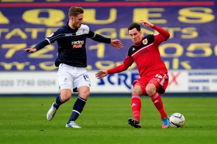Framed Print : Championship Showdown: Millwall's James Henry Stops Gregg Cunningham of Bristol City