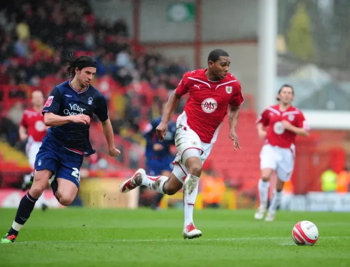 Framed Print : Chasing the Championship Victory: Marvin Elliott vs. George Boyd - Intense Rivalry on the Pitch (Bristol City vs. Nottingham Forest, 03 / 04 / 2010)