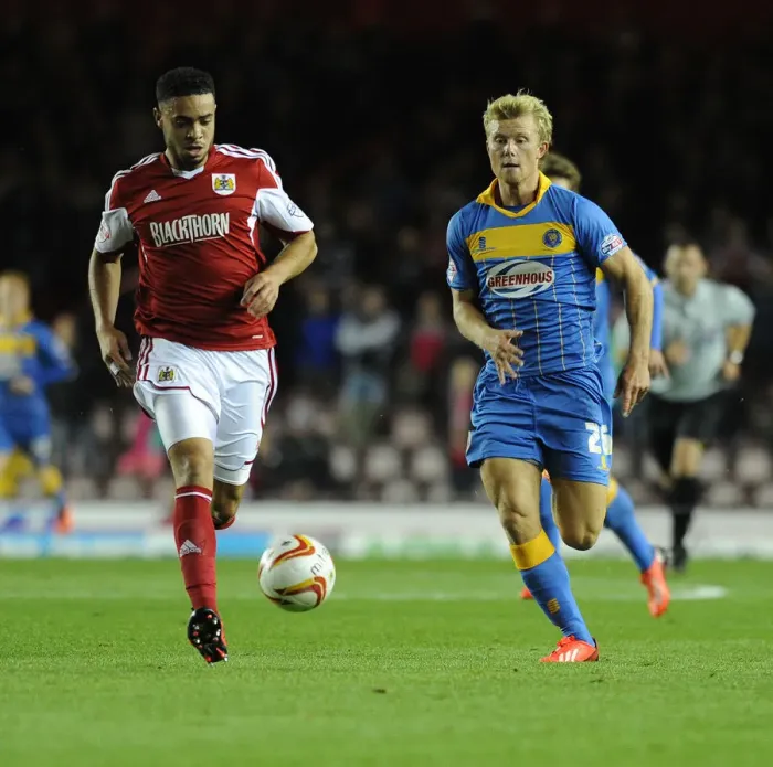 Framed Print : Chasing the Win: Intense Moment as Curtis Main of Shrewsbury Town Pursues Derrick Williams of Bristol City