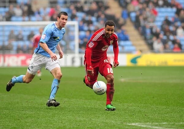 Chasing the Win: Nicky Maynard of Bristol City Pursues the Loose Ball in Coventry City Clash, Championship 2011