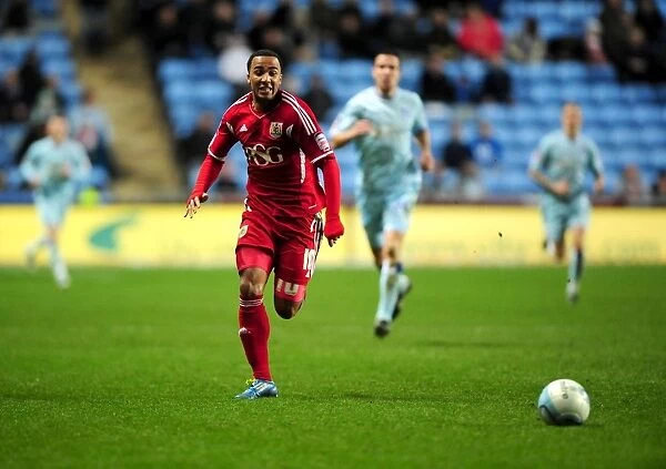 Chasing the Win: Nicky Maynard of Bristol City Pursues Loose Ball in Coventry City Match, December 2011 - Championship Football