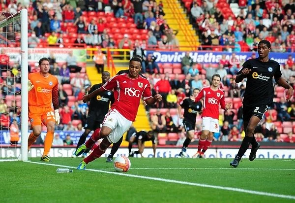 Chasing the Win: Nicky Maynard Pursues Loose Ball in Intense Championship Match between Bristol City and Peterborough United (15 / 10 / 2011)
