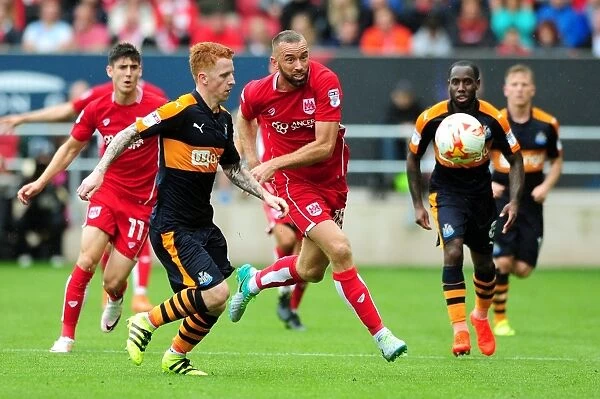Chasing the Win: Wilbraham Pursues the Ball in Intense Bristol City vs. Newcastle United Match