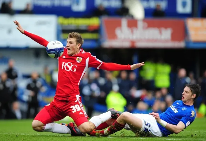 Framed Print : Chris Wood Foul by Greg Halford: Portsmouth vs. Bristol City Football Match, 17th March 2012