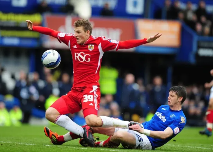Framed Print : Chris Wood Fouled by Greg Halford during Portsmouth vs. Bristol City Football Match, 17th March 2012