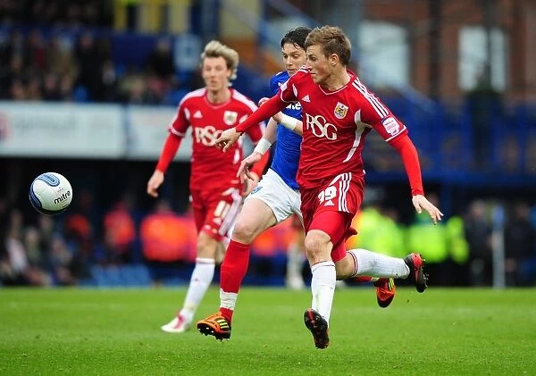 Chris Wood vs. Greg Halford: Battle for the Ball in Portsmouth v Bristol City Football Match, March 17, 2012