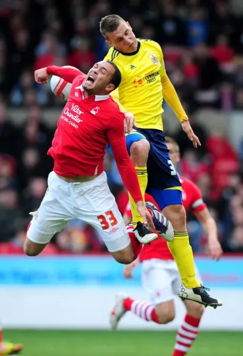 Framed Print : Chris Wood vs. Joel Lynch: Battle for Supremacy in Nottingham Forest vs. Bristol City Football Match, April 2012