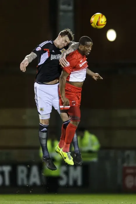 Framed Print : Clash in the Air: Aden Flint vs. Moses Odubajo in Leyton Orient vs. Bristol City Football Match