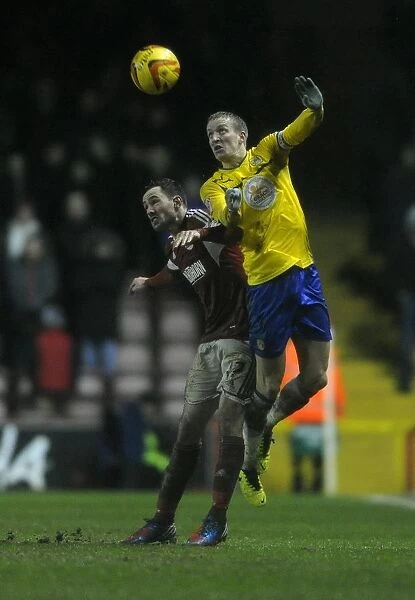 Clash in the Air: Cunningham vs. Baker in Bristol City vs. Coventry City Football Match, February 2014