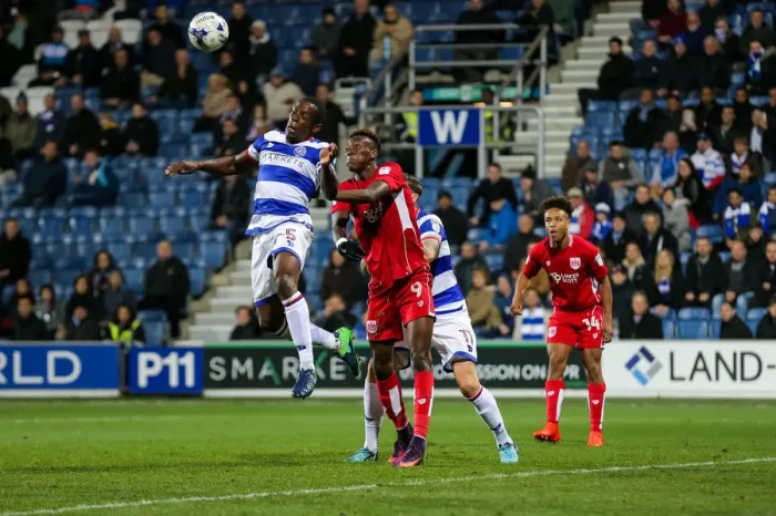 Framed Print : Clash in the Air: Onuoha vs. Abraham at Loftus Road