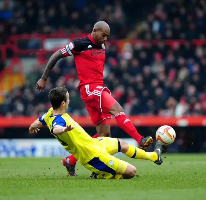 Framed Print : Clash at Ashton Gate: Marvin Elliott vs. Danny Pugh Tackle - Npower Championship, 2013