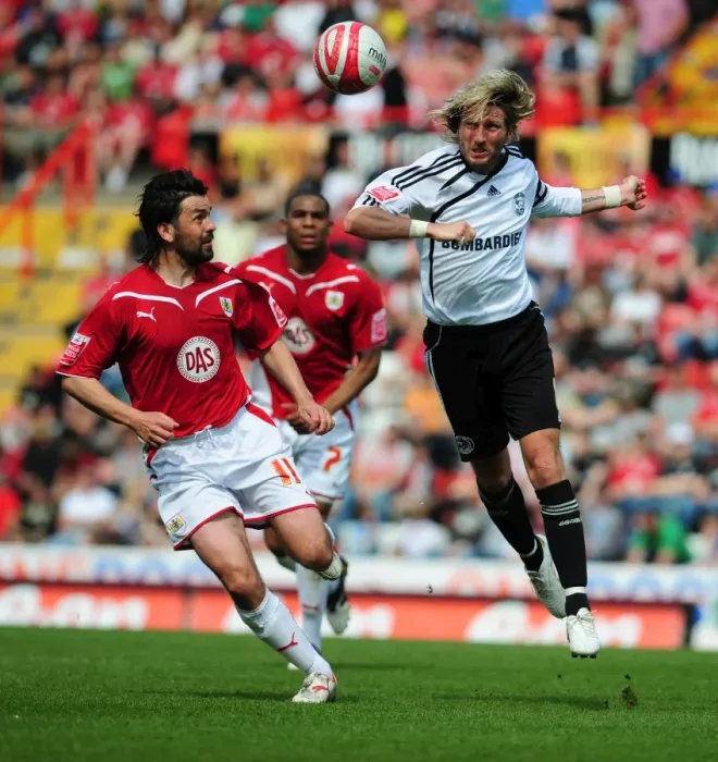 Framed Print : Clash at Ashton Gate: Robbie Savage and Paul Hartley Battle for Aerial Supremacy in Derby County vs. Bristol City Championship Showdown, 2010 Framed Print : Clash at Ashton Gate: Robbie Savage and Paul Hartley Battle for Aerial Supremacy in Derby County vs. Bristol City Championship Showdown, 2010