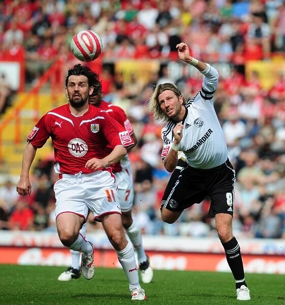 Clash at Ashton Gate: Robbie Savage vs. Paul Hartley Battle for Aerial Supremacy - Derby County vs. Bristol City, Championship 2010