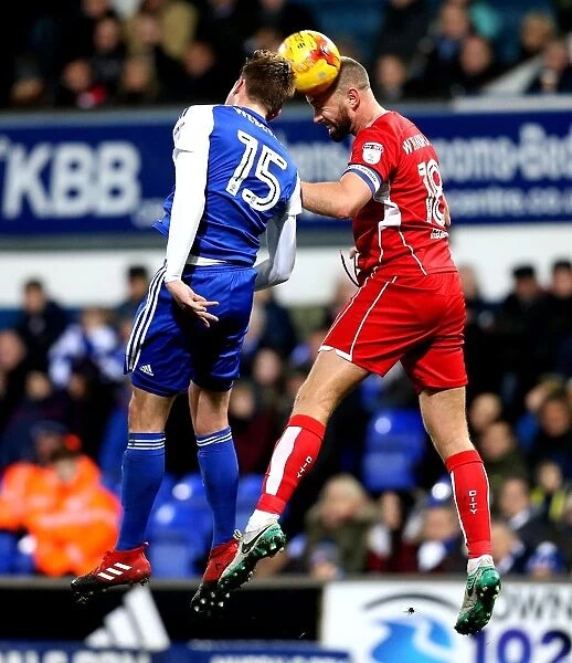 Clash at the Crossbar: Wilbraham vs. Webster in Intense Heading Duel during Ipswich Town vs. Bristol City Championship Match