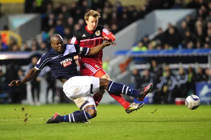 Framed Print : Clash at The Den: Martyn Woolford Thwarted by Danny Shittu