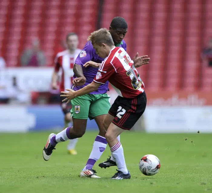 Framed Print : Clash of Forces: Mark Little vs. Louis Reed in Sky Bet League One Opener at Bramal Lane Framed Print : Clash of Forces: Mark Little vs. Louis Reed in Sky Bet League One Opener at Bramal Lane