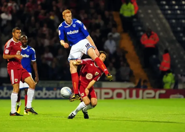 Framed Print : Clash at Fratton Park: Cole Skuse vs. Dave Kitson - Portsmouth vs. Bristol City, Championship Football, 2010