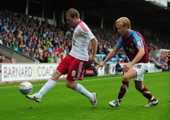 Framed Print : Clash at Glanford Park: David Clarkson vs. Josh Wright in Championship Battle Framed Print : Clash at Glanford Park: David Clarkson vs. Josh Wright in Championship Battle