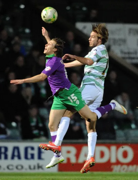 Framed Print : Clash at Huish Park: Luke Freeman vs. Sam Foley in Sky Bet League One Showdown Framed Print : Clash at Huish Park: Luke Freeman vs. Sam Foley in Sky Bet League One Showdown