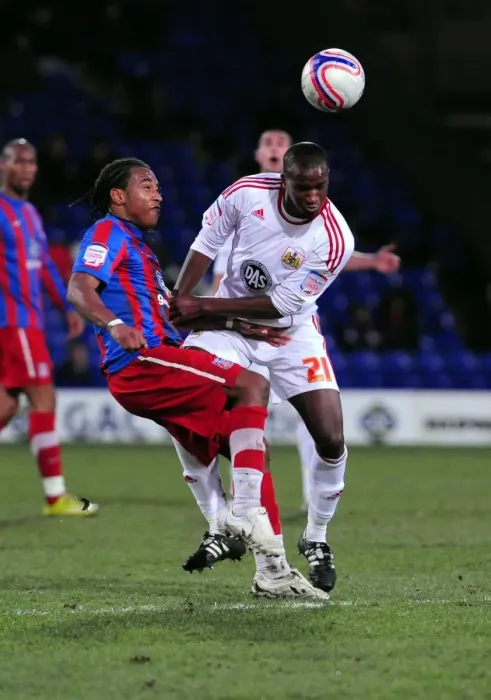 Framed Print : Clash at Selhurst Park: Kalifa Cisse Braves the Pain Against Neil Danns, Crystal Palace vs. Bristol City, Championship 2011