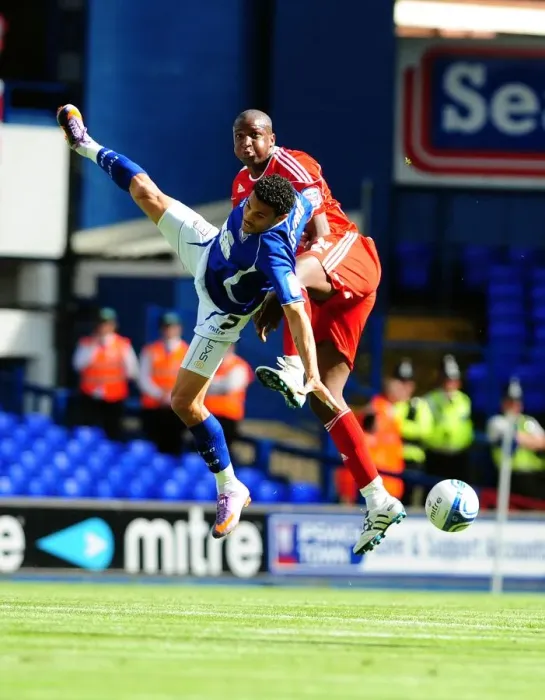 Framed Print : Clash in the Sky: Cisse vs. Edwards - Championship Showdown (August 2010) - Ipswich v Bristol City: Kalifa Cisse Challenges Carlos Edwards for the Aerial Ball
