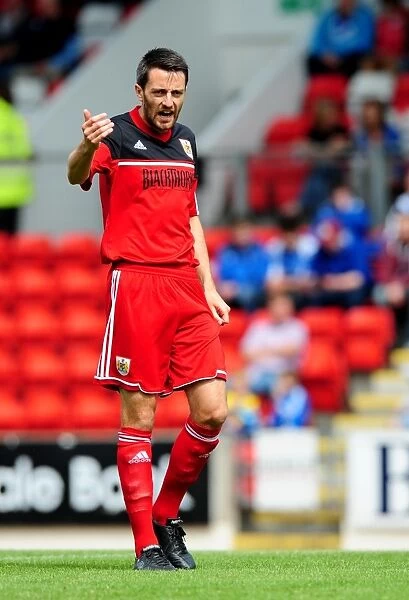 Cole Skuse in Action: Bristol City's Midfielder Fights for Possession at McDiarmid Park (2012)