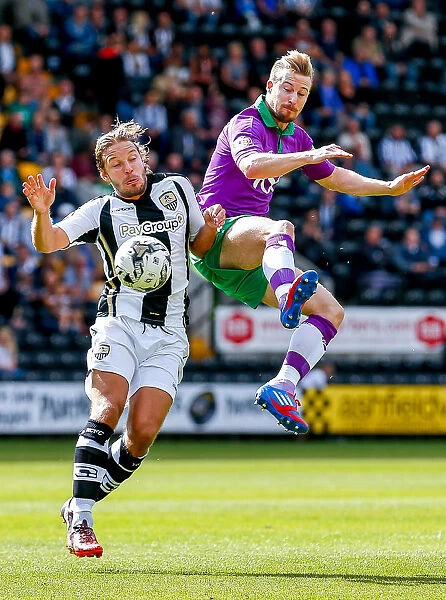 Competing in the Air: Smith vs. Elliott in Notts County vs. Bristol City Football Match, 2014