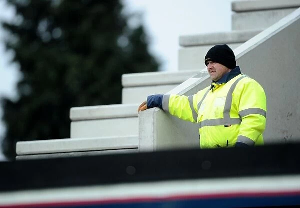 Construction Worker Pauses for Bristol City vs. Gillingham Match at Ashton Gate, 2015