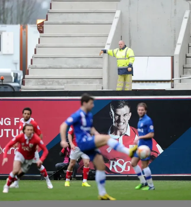 Framed Print : Construction Worker Taking a Break to Watch Bristol City vs. Gillingham at Ashton Gate, 2015 Framed Print : Construction Worker Taking a Break to Watch Bristol City vs. Gillingham at Ashton Gate, 2015