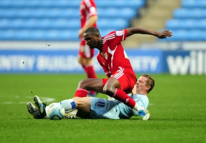 Framed Print : Coventry's McSheffrey Fouls Bristol City's Cisse in Championship Clash - 26 / 12 / 2011