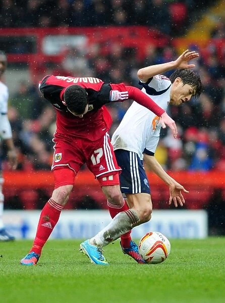 Cunningham vs Chung-Yong: Intense Moment in Bristol City vs Bolton Wanderers Match