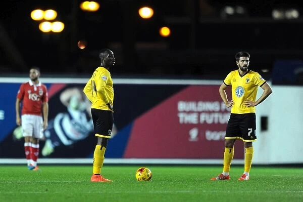 Dejected Adebayo Azeez and George Francomb of AFC Wimbledon after Loss to Bristol City