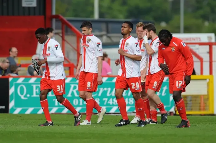 Framed Print : Dejected Stevenage Players: Relegation Confirmed After 1-3 Loss to Bristol City Framed Print : Dejected Stevenage Players: Relegation Confirmed After 1-3 Loss to Bristol City