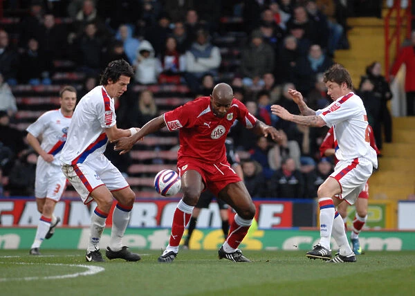 Dele Adebola fights off attention from john oster and Jose Fonte