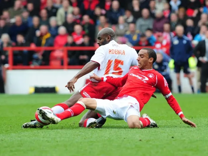 Framed Print : Dele Adebola vs. James Perch: Intense Rivalry on the Football Field Framed Print : Dele Adebola vs. James Perch: Intense Rivalry on the Football Field