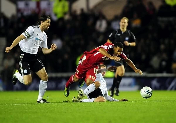 Derby County's Craig Bryson Fouls Nicky Maynard in Championship Clash between Derby County and Bristol City - December 10, 2011