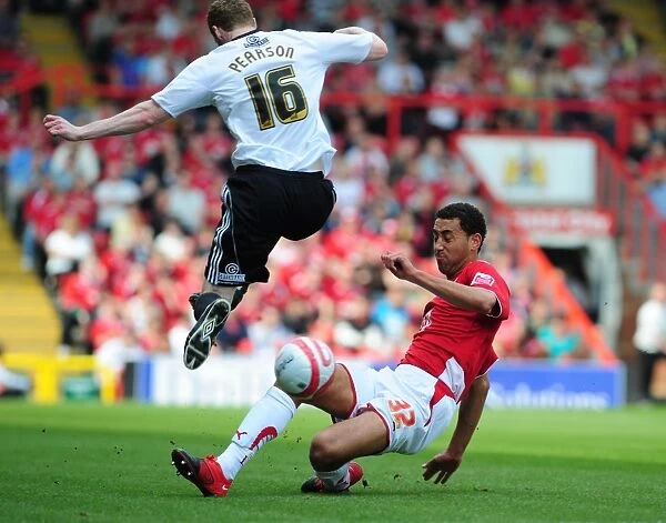 Derby County's Stephen Pearson Tackled by Lewin Nyatanga of Bristol City - Championship Clash, April 2010