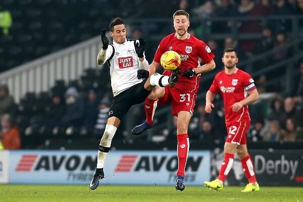 Derby County's Thomas Ince Tackles Jens Hegeler of Bristol City in Sky Bet Championship Clash