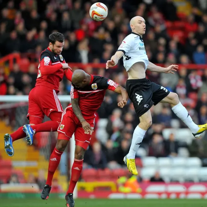Framed Print : Derby's Sammon Soars Above Bristol City Defenders Framed Print : Derby's Sammon Soars Above Bristol City Defenders