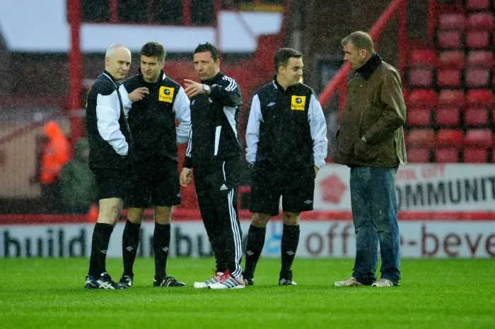 Framed Print : Derek McInnes Discusses with Officials as Bristol City vs. Watford Championship Match is Postponed (December 2012)