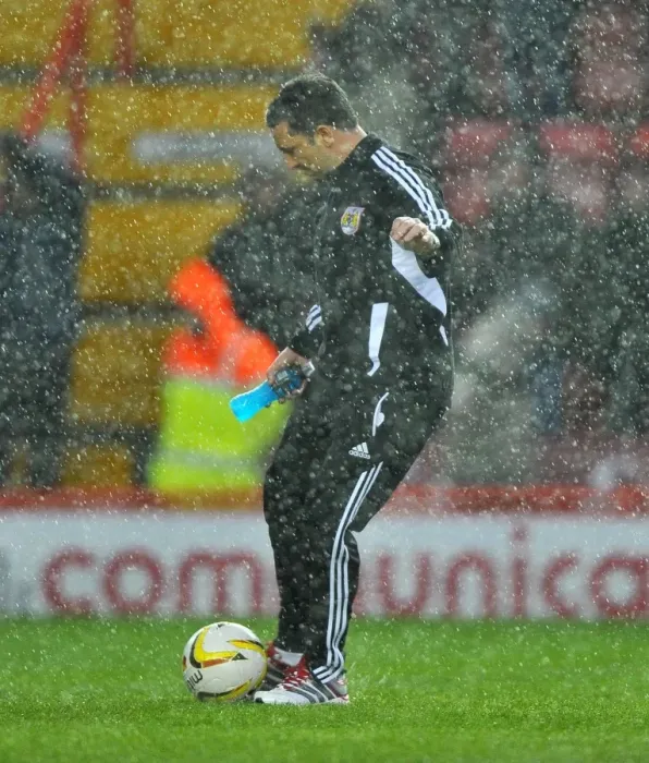 Framed Print : Derek McInnes Investigates Floodlit Pitch as Championship Match between Bristol City and Watford is Abandoned (December 26, 2012)