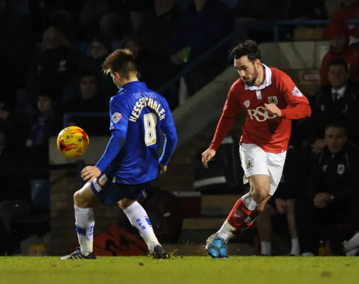 Framed Print : Derrick Williams of Bristol City Battles Past Jake Hessenthaler in Johnstone's Paint Trophy Clash at Priestfield Stadium Framed Print : Derrick Williams of Bristol City Battles Past Jake Hessenthaler in Johnstone's Paint Trophy Clash at Priestfield Stadium