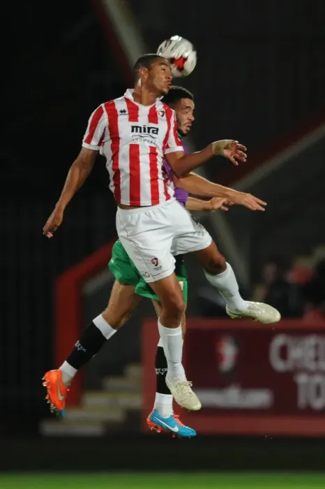 Framed Print : Derrick Williams vs Byron Harrison: Intense Battle for the Ball in Cheltenham Town vs Bristol City Football Match, October 2014 Framed Print : Derrick Williams vs Byron Harrison: Intense Battle for the Ball in Cheltenham Town vs Bristol City Football Match, October 2014