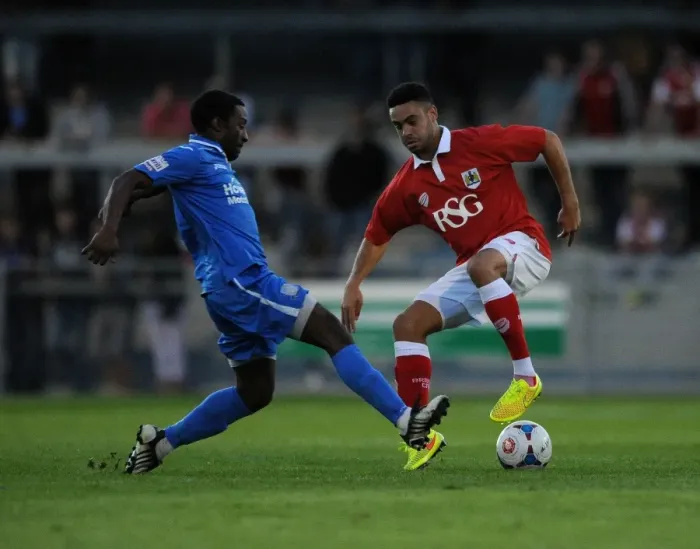 Framed Print : Derrick Williams vs Jake Mawford: Intense Clash in Pre-Season Friendly between Weston-super-Mare and Bristol City