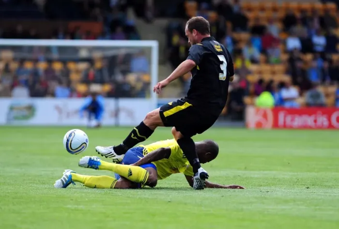Framed Print : Determined Marvin Elliott Tackles in Torquay vs. Bristol City Clash